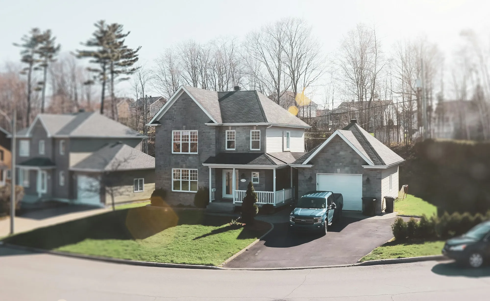 Gray two-story house with a garage on a suburban cul-de-sac